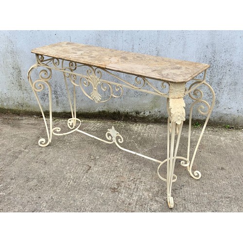 1026 - A large vintage ornate marble top console table on an wrought iron base. 142 x 46 x 90cm