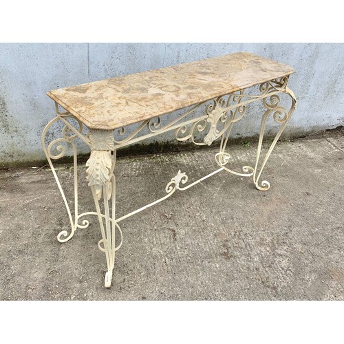 1026 - A large vintage ornate marble top console table on an wrought iron base. 142 x 46 x 90cm