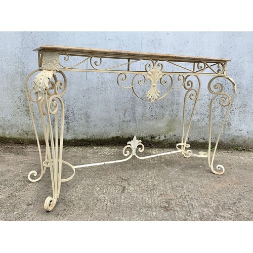 1026 - A large vintage ornate marble top console table on an wrought iron base. 142 x 46 x 90cm