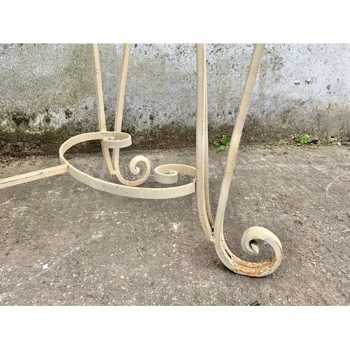 1026 - A large vintage ornate marble top console table on an wrought iron base. 142 x 46 x 90cm