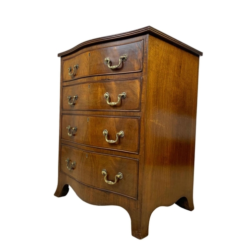 966 - An early 20th century Georgian style mahogany serpentine chest of drawers with brass drop handles. 6... 