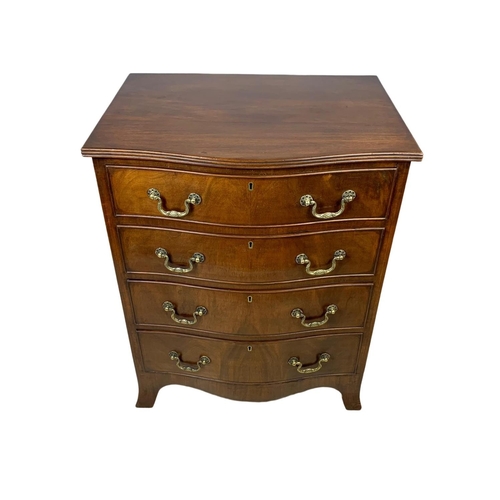 966 - An early 20th century Georgian style mahogany serpentine chest of drawers with brass drop handles. 6... 