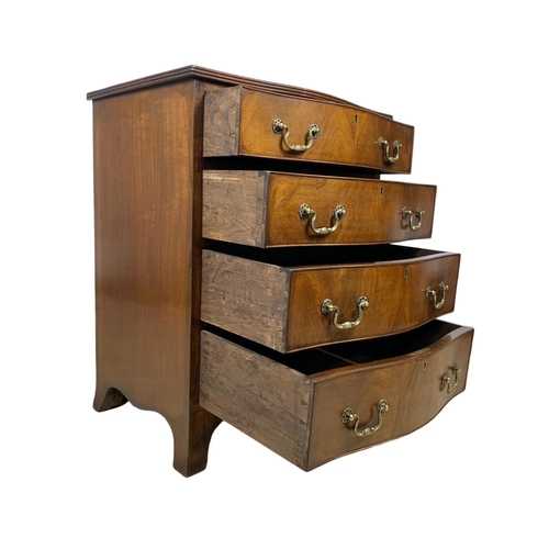 966 - An early 20th century Georgian style mahogany serpentine chest of drawers with brass drop handles. 6... 