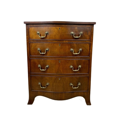 966 - An early 20th century Georgian style mahogany serpentine chest of drawers with brass drop handles. 6... 