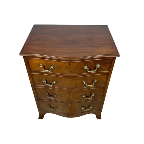 966 - An early 20th century Georgian style mahogany serpentine chest of drawers with brass drop handles. 6... 