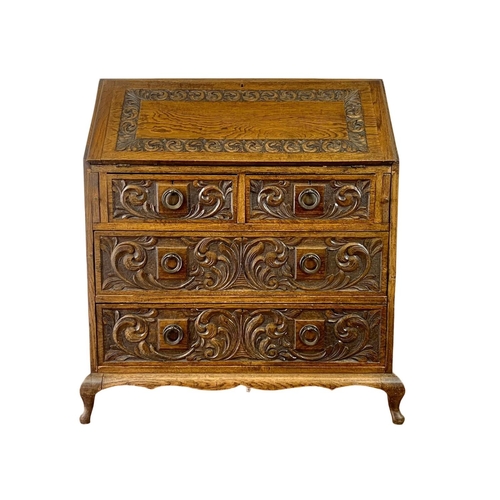 998 - Late 19th century carved oak writing bureau with 4 drawers and copper Art Nouveau handles. Circa 189... 