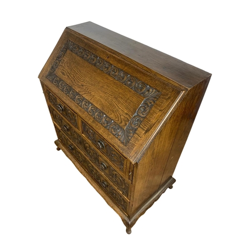 998 - Late 19th century carved oak writing bureau with 4 drawers and copper Art Nouveau handles. Circa 189... 