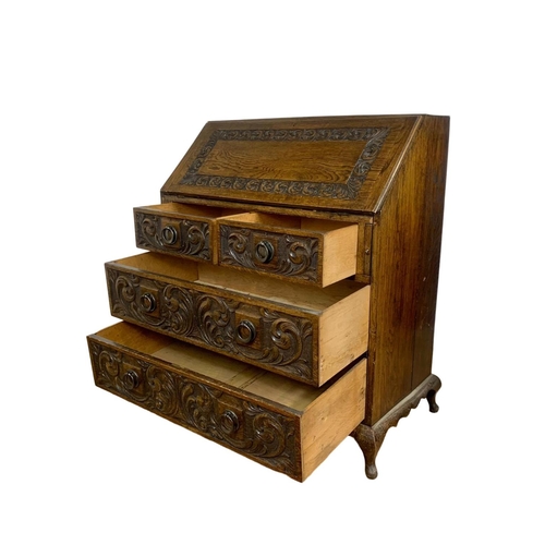 998 - Late 19th century carved oak writing bureau with 4 drawers and copper Art Nouveau handles. Circa 189... 