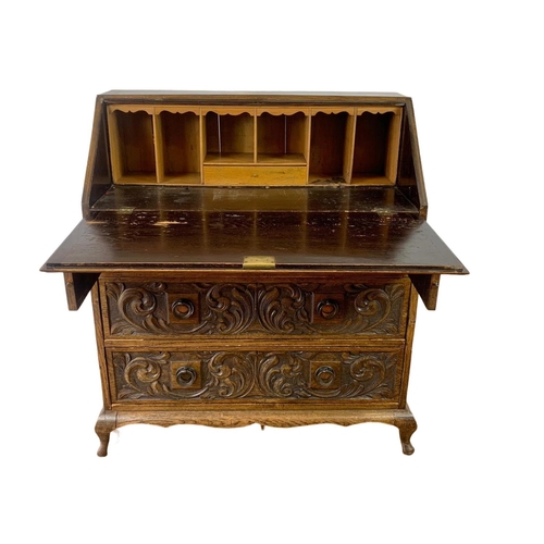 998 - Late 19th century carved oak writing bureau with 4 drawers and copper Art Nouveau handles. Circa 189... 