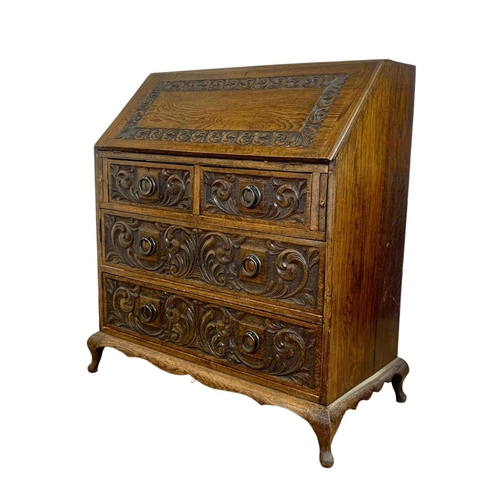 998 - Late 19th century carved oak writing bureau with 4 drawers and copper Art Nouveau handles. Circa 189... 