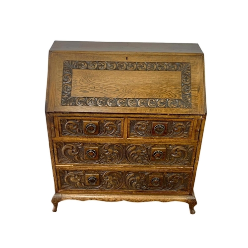 998 - Late 19th century carved oak writing bureau with 4 drawers and copper Art Nouveau handles. Circa 189... 