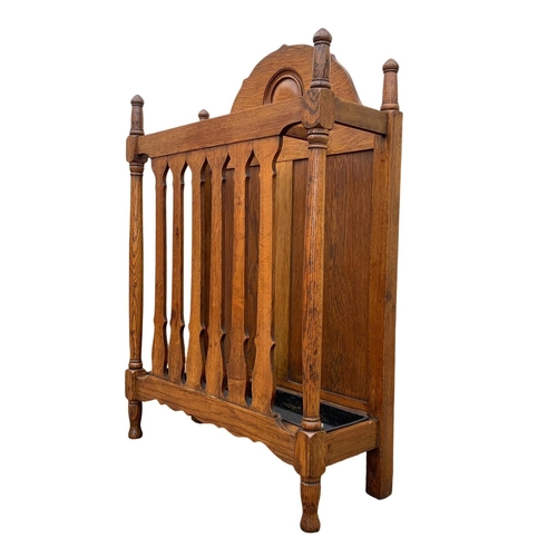 1006 - A late Victorian oak umbrella stick stand. Circa 1890/1900. 61.5 x 22.5 x 91cm.