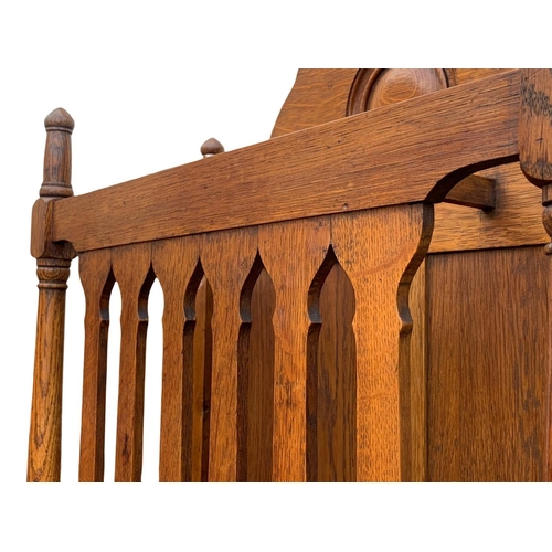 1006 - A late Victorian oak umbrella stick stand. Circa 1890/1900. 61.5 x 22.5 x 91cm.