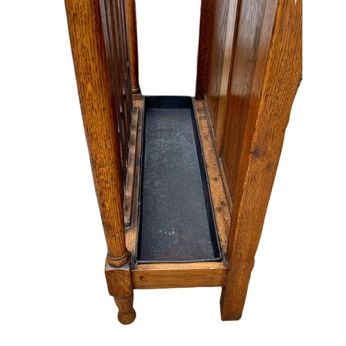 1006 - A late Victorian oak umbrella stick stand. Circa 1890/1900. 61.5 x 22.5 x 91cm.