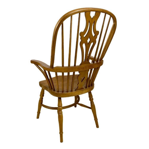 1016 - Large 19th century style oak Windsor armchair. 66 x 62 x 114cm