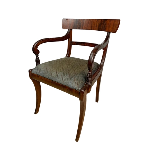 982 - Early 19th century Regency mahogany armchair with sabre legs.