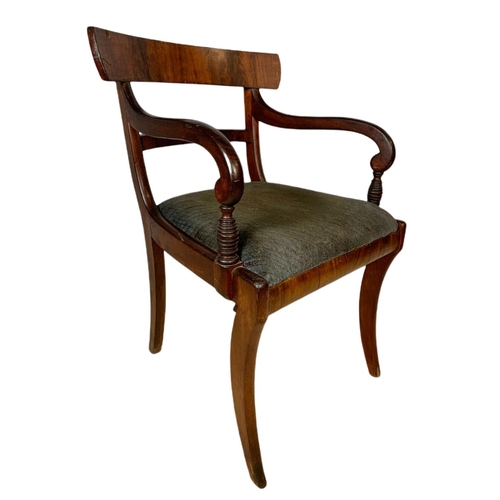 982 - Early 19th century Regency mahogany armchair with sabre legs.