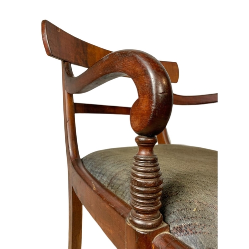 982 - Early 19th century Regency mahogany armchair with sabre legs.