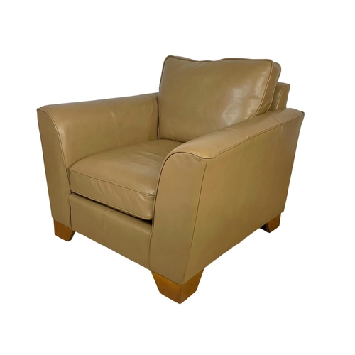 797 - A large leather armchair. 101 x 101 x 90cm.