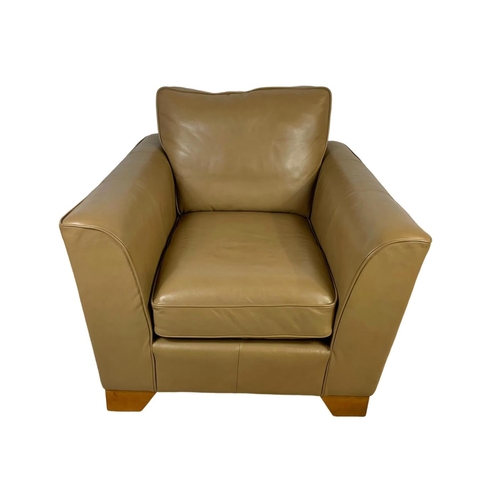 797 - A large leather armchair. 101 x 101 x 90cm.