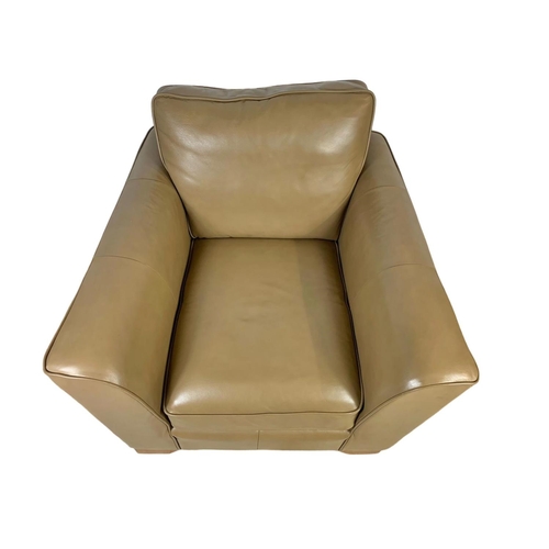 797 - A large leather armchair. 101 x 101 x 90cm.