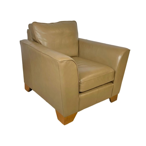 797 - A large leather armchair. 101 x 101 x 90cm.