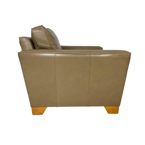 797 - A large leather armchair. 101 x 101 x 90cm.