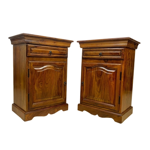 1039 - A pair of rosewood bedside cabinets with drawer. 49 x 34 x 69cm.