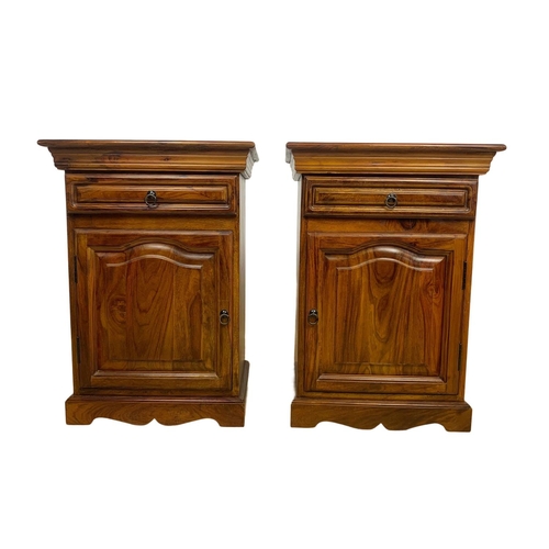 1039 - A pair of rosewood bedside cabinets with drawer. 49 x 34 x 69cm.