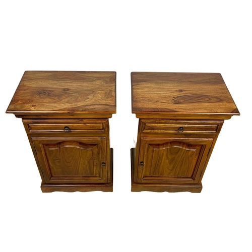 1039 - A pair of rosewood bedside cabinets with drawer. 49 x 34 x 69cm.