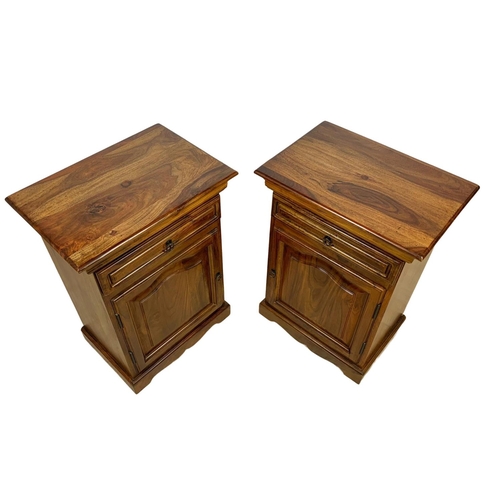 1039 - A pair of rosewood bedside cabinets with drawer. 49 x 34 x 69cm.