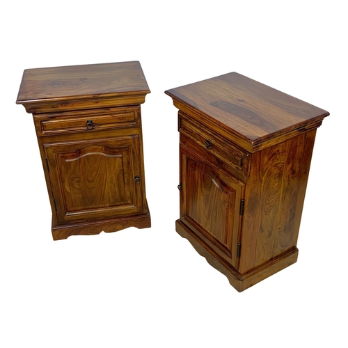 1039 - A pair of rosewood bedside cabinets with drawer. 49 x 34 x 69cm.