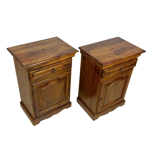 1039 - A pair of rosewood bedside cabinets with drawer. 49 x 34 x 69cm.