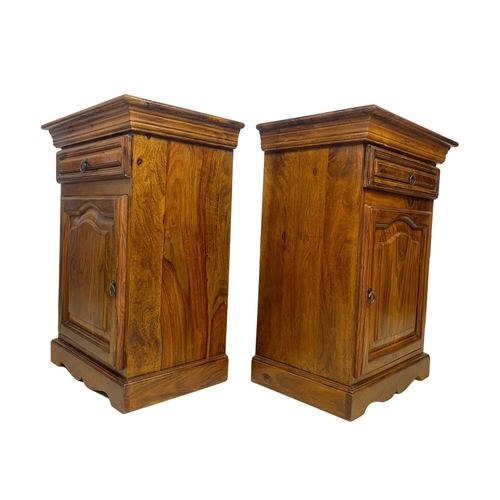 1039 - A pair of rosewood bedside cabinets with drawer. 49 x 34 x 69cm.