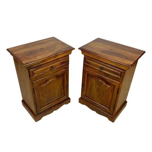 1039 - A pair of rosewood bedside cabinets with drawer. 49 x 34 x 69cm.