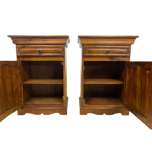 1039 - A pair of rosewood bedside cabinets with drawer. 49 x 34 x 69cm.