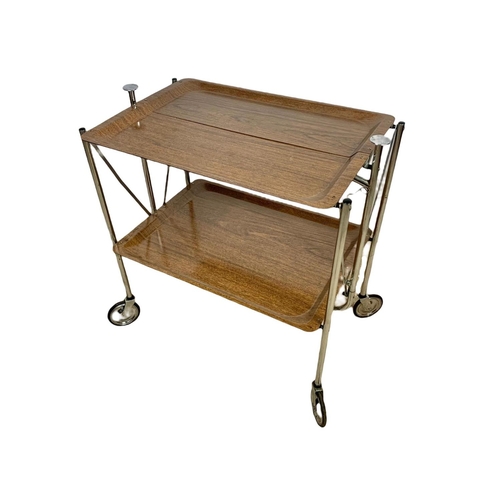 994 - A folding 2 tier chrome and laminate serving trolley. Mid century. Circa 1970. 65 x 42 x 70.5cm.