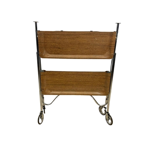 994 - A folding 2 tier chrome and laminate serving trolley. Mid century. Circa 1970. 65 x 42 x 70.5cm.