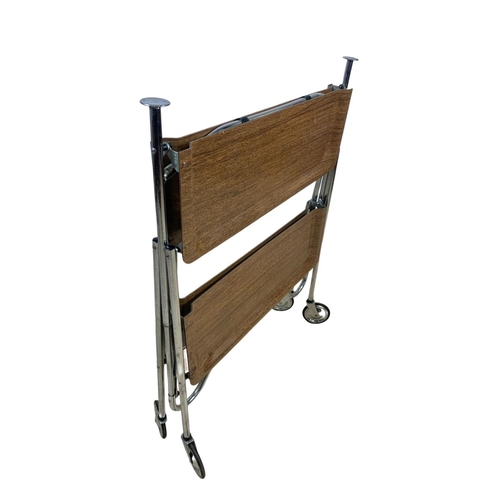 994 - A folding 2 tier chrome and laminate serving trolley. Mid century. Circa 1970. 65 x 42 x 70.5cm.