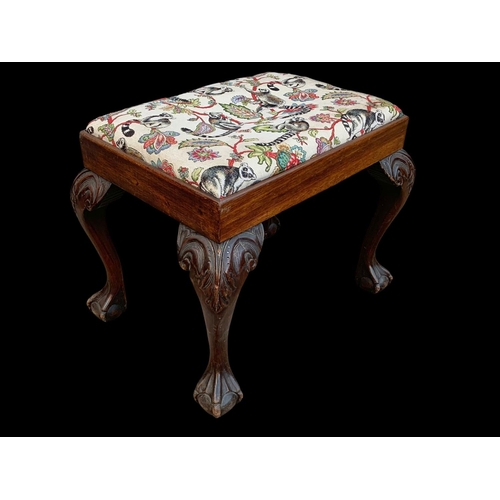 1005 - An early 20th century carved mahogany stool. Circa 1920-1930. 64 x 47 x 52cm