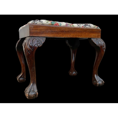 1005 - An early 20th century carved mahogany stool. Circa 1920-1930. 64 x 47 x 52cm