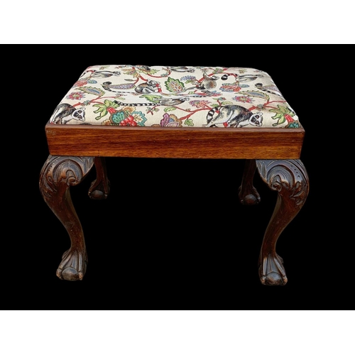 1005 - An early 20th century carved mahogany stool. Circa 1920-1930. 64 x 47 x 52cm