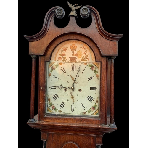 1008 - A Victorian oak long case clock with weights. 204cm.