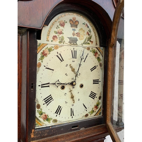 1008 - A Victorian oak long case clock with weights. 204cm.