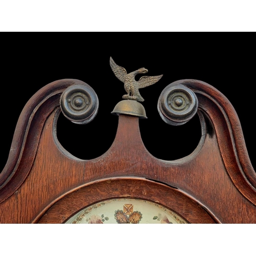 1008 - A Victorian oak long case clock with weights. 204cm.