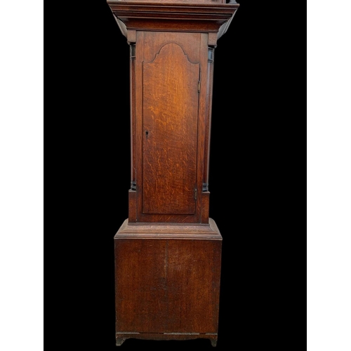 1008 - A Victorian oak long case clock with weights. 204cm.