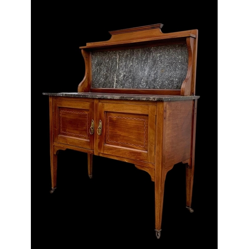 1010 - An Edwardian inlaid mahogany marble top washstand. 106.5 x 45 x 127cm.