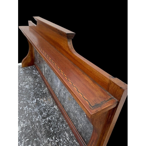 1010 - An Edwardian inlaid mahogany marble top washstand. 106.5 x 45 x 127cm.