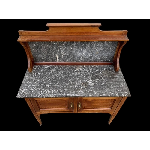 1010 - An Edwardian inlaid mahogany marble top washstand. 106.5 x 45 x 127cm.