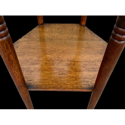 1011 - An Edwardian Arts & Crafts oak 2 tier side table. 55 x 47.5 x 71cm.